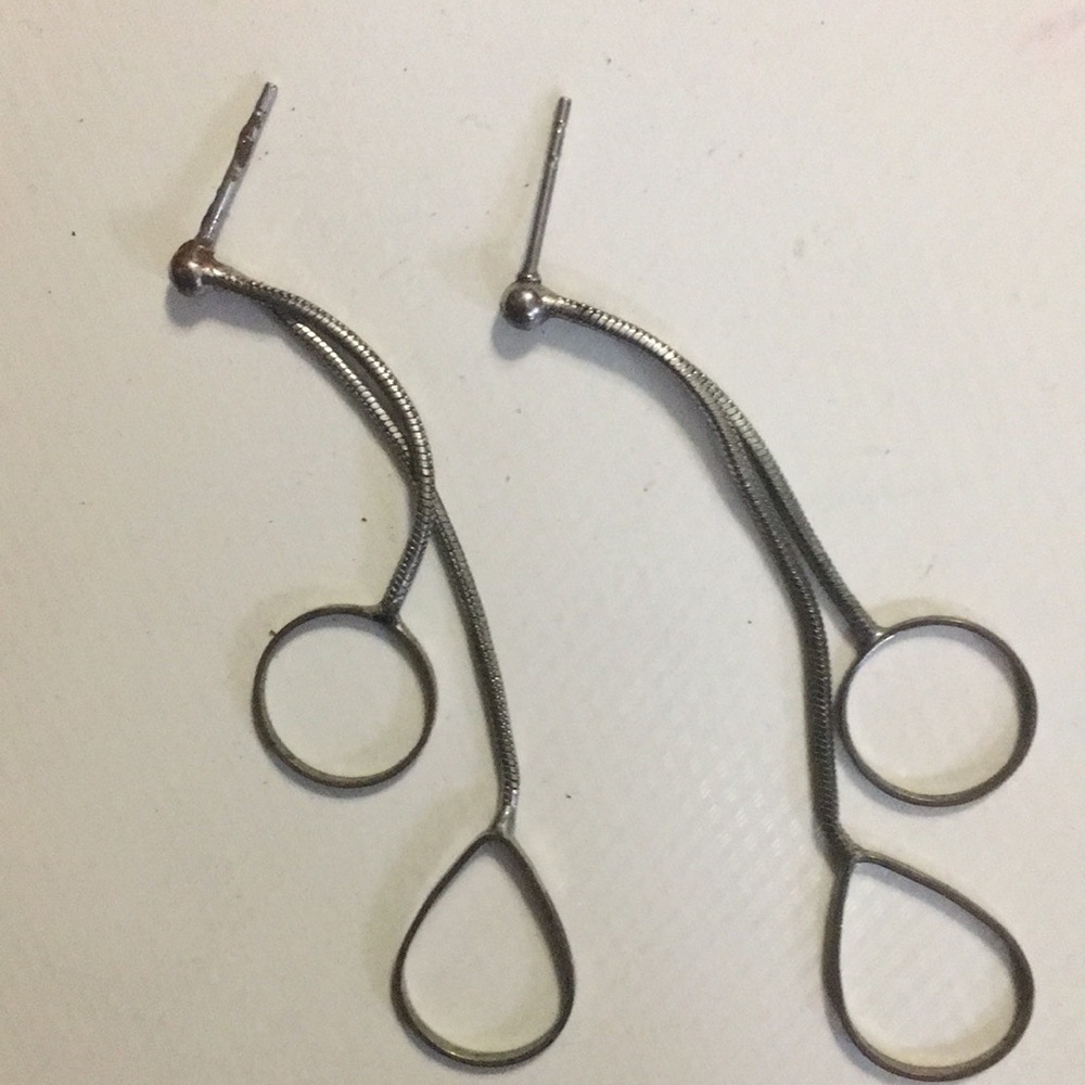 A pair of long two circled earrings